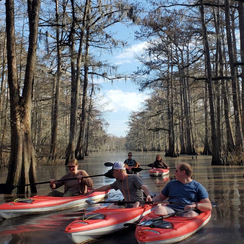 a group of people on a boat in the water