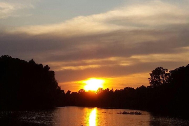 a sunset over a body of water