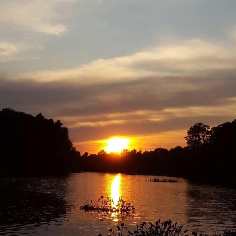 a sunset over a body of water